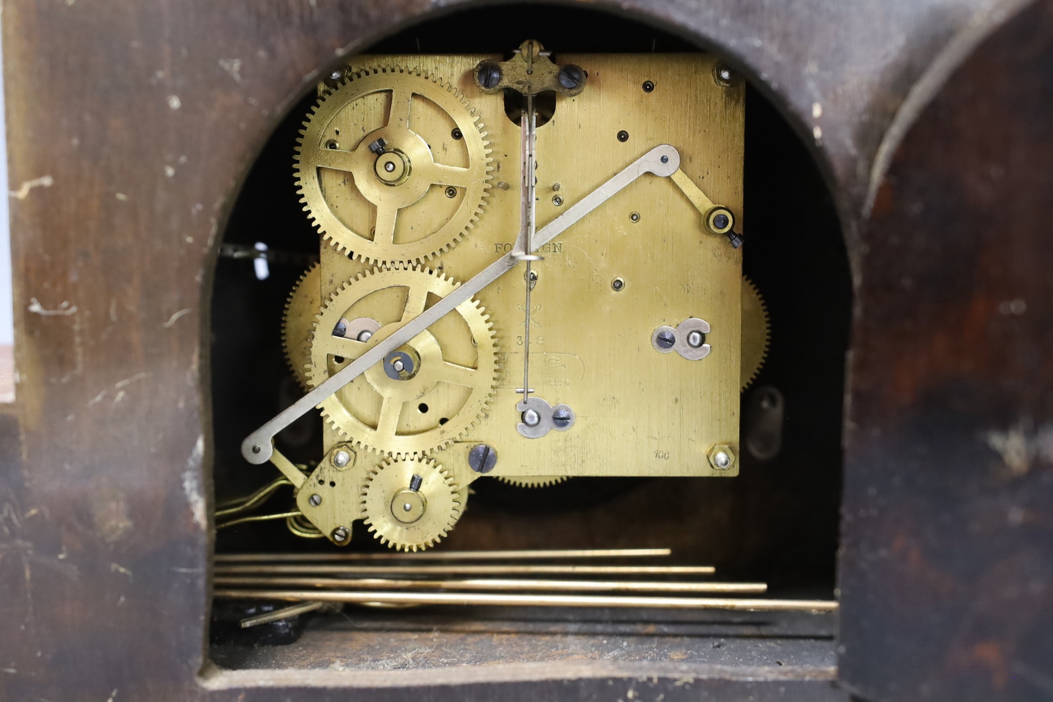 An Art Deco walnut mantel clock, 38 cms wide.